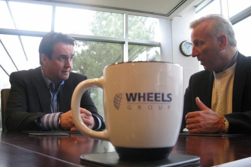 Mike McCarron (left) and Wheels Group CEO Doug Tozer talk about the deal.