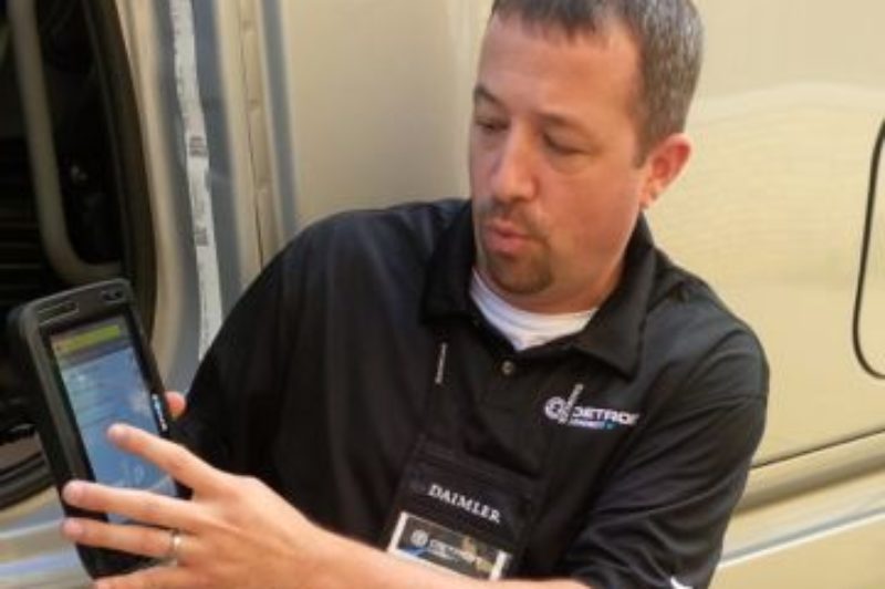 A Detroit Connect official demonstrates how the company's new tablet can be used to ensure better pre-trip inspections.