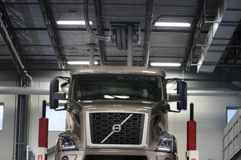 Volvo mechanic under truck