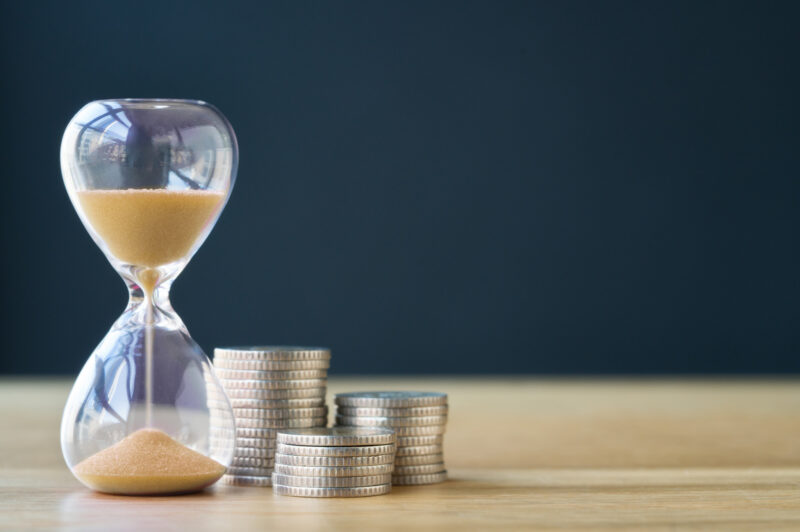 Time and stack of coins.