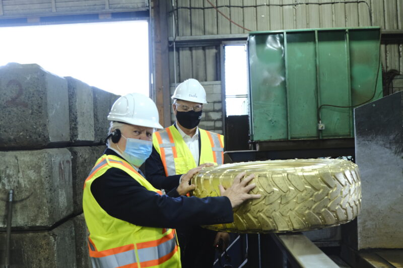 Dignitaries recycle tire at Western Rubber Products