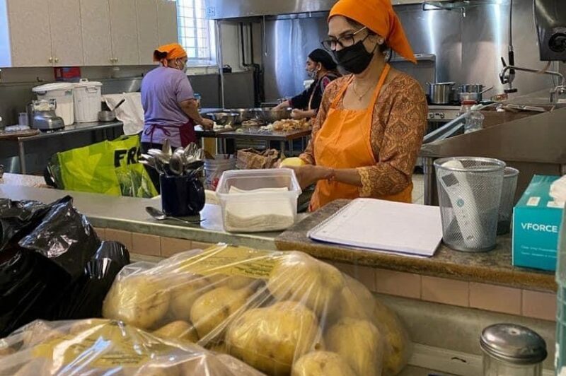 Volunteers prepare meals