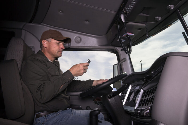 truck driver with cellphone