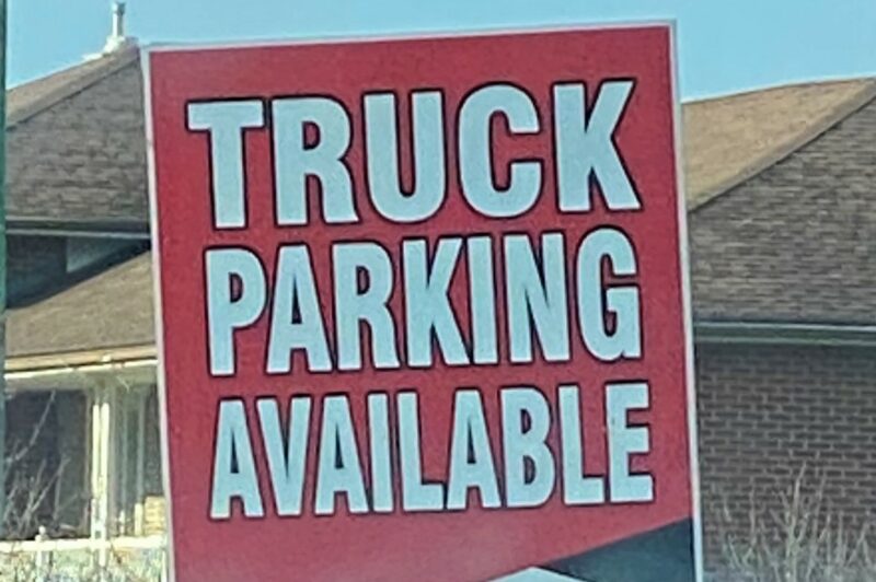 Advertising sign for truck parking