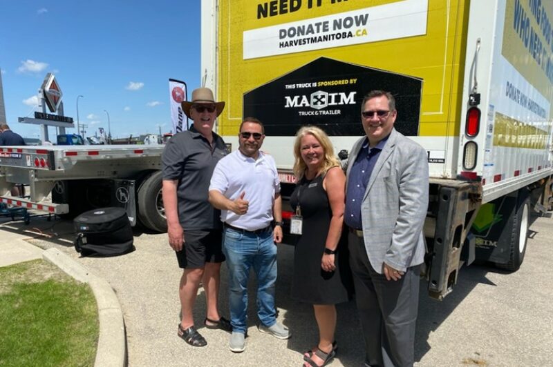 Picture of Maxim truck and officials