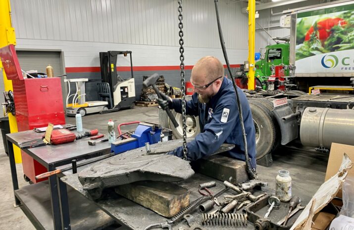 Mechanic works on a fifth wheel
