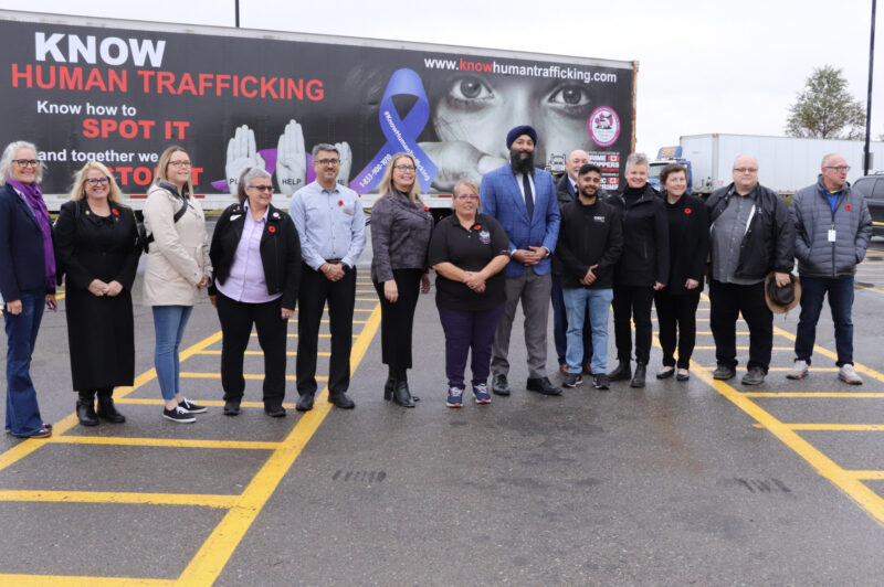 People standing in front of a trailer