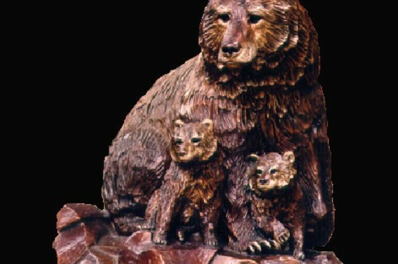 The image is of the award in the shape of the bear and two of its cubs made out of metal