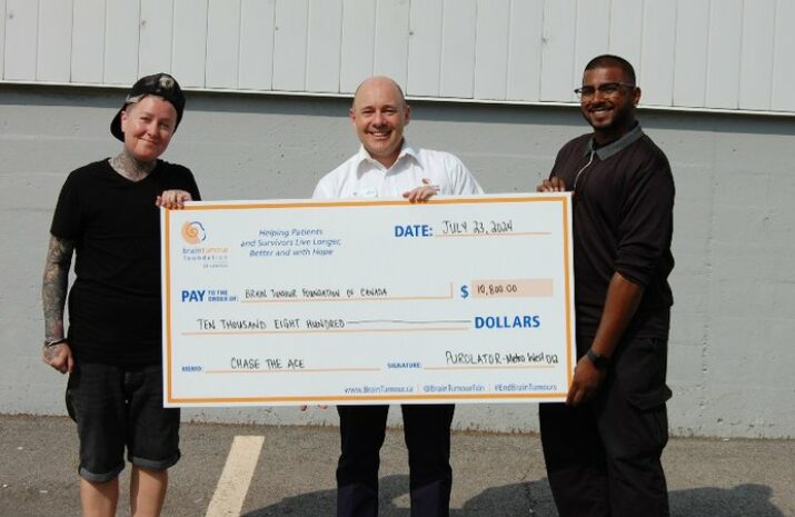 Purolator presenting a cheque for $10,000