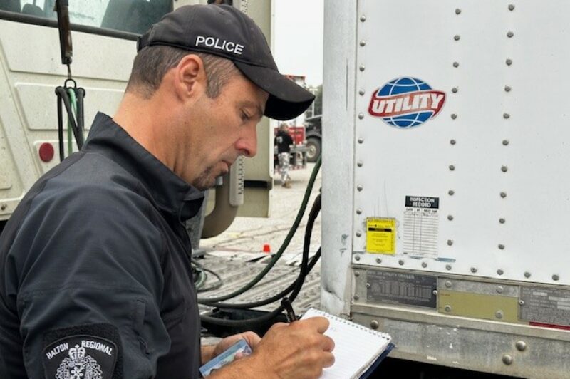 HRPS officer inspecting a trailer