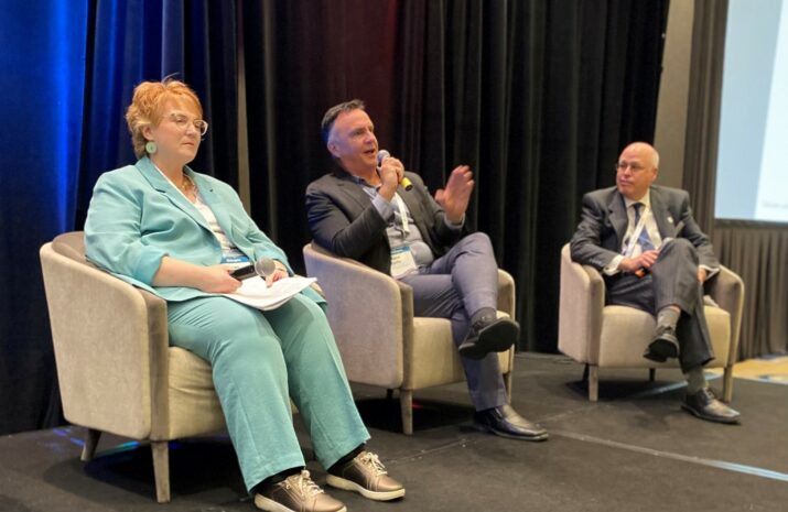 Three people on stage