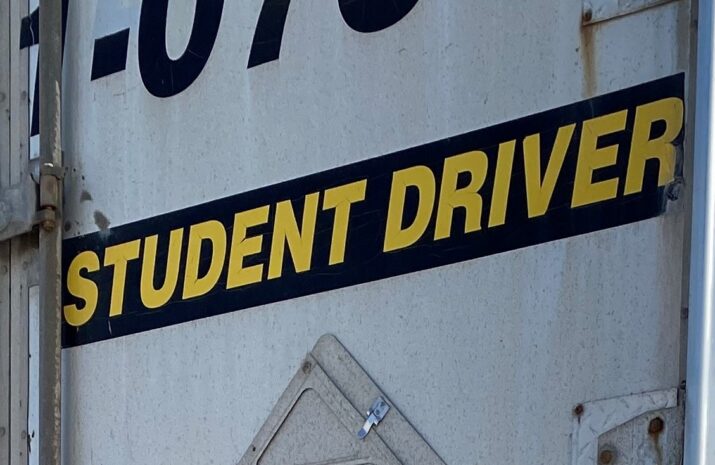 Picture of a trailer with Student Driver painted on it
