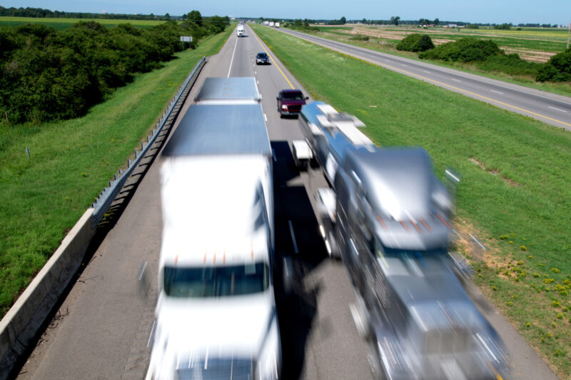Motion-blurred 18-wheelers zipping down Interstate 40 in east Arkansas.