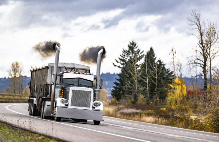 Truck with smoke coming from the exhaust pipes