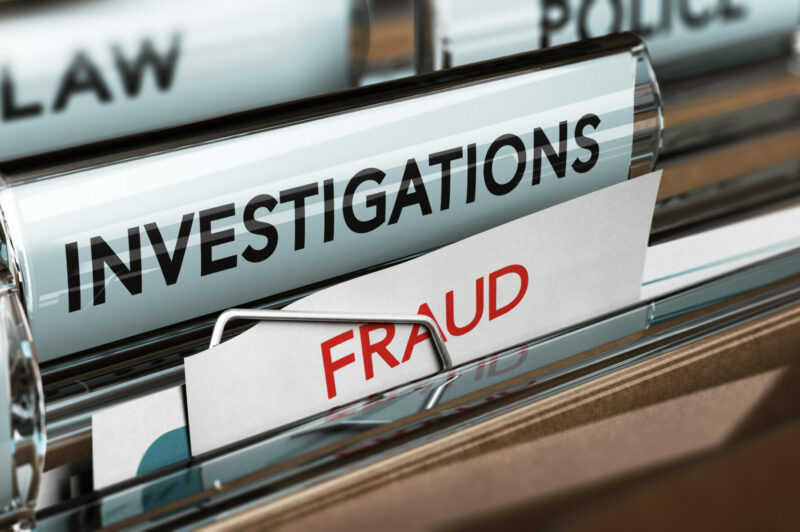 Picture of files marked fraud, investigation