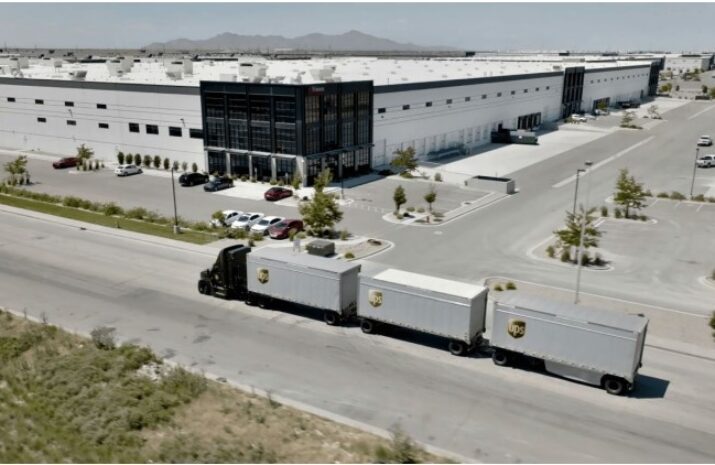A UPS truck hauling three trailers