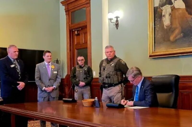 Wyoming Gov. Mark Gordon signs the law.